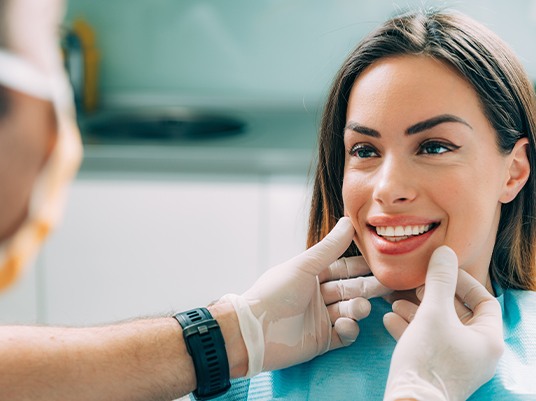 dentist checking womans smile
