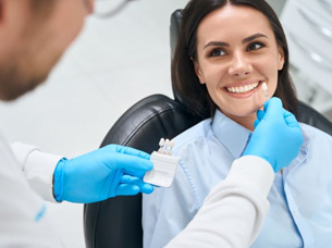 Dentist shade-matching patient for a dental crown