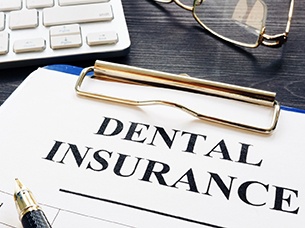 Dental insurance paperwork for the cost of dental implants in Arlington 