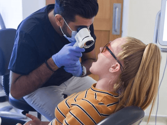 girl getting oral cancer screenings