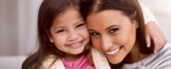 mother and daughter smiling