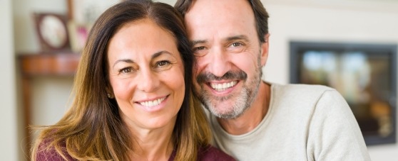 husband and wife smiling