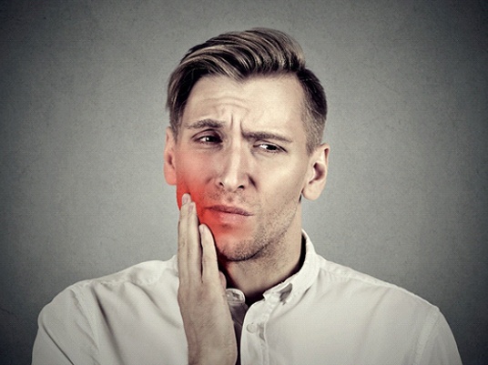 A man with dental pain.