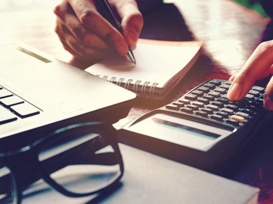 Woman using a calculator