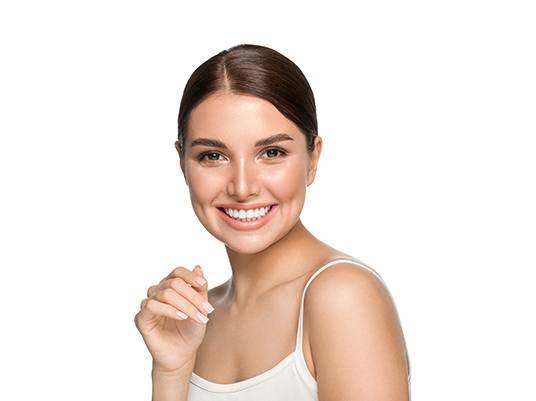 woman smiling after receiving veneers