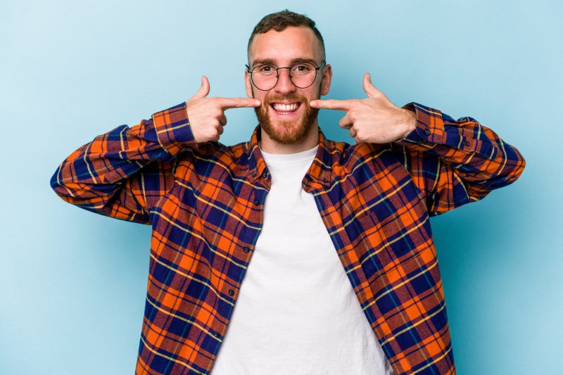 a man smiling about veneers or crowns in Arlington