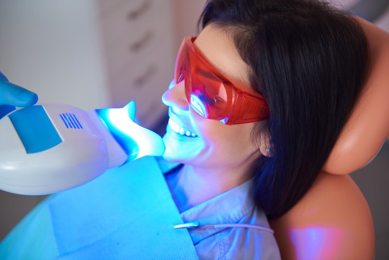 A woman undergoing teeth whitening treatment